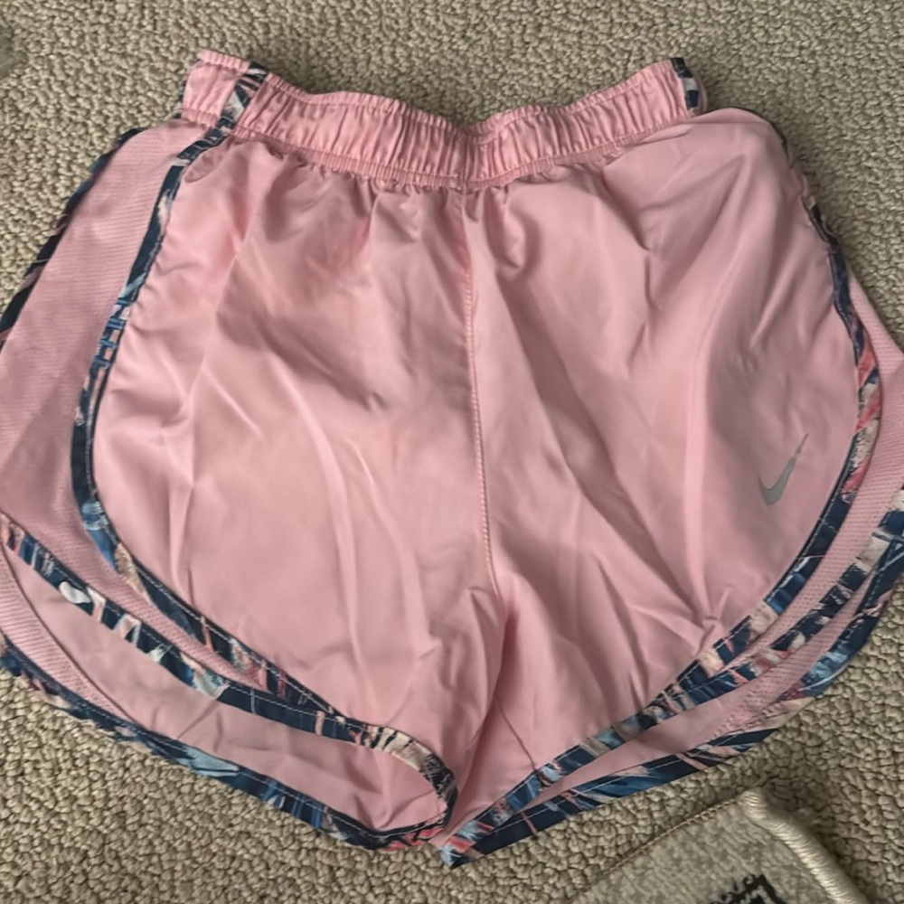 Nike: pink athletic shorts
